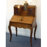 A 19th century figured walnut and marquetry Bureau De Dame,