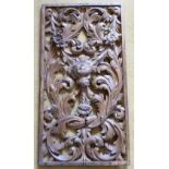 An antique bleached oak pieced Panel finely carved with foliage, leaves and flower heads etc.