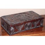 An antique Numismatist's Box profusely carved in Folk Art style and also carved to the underside