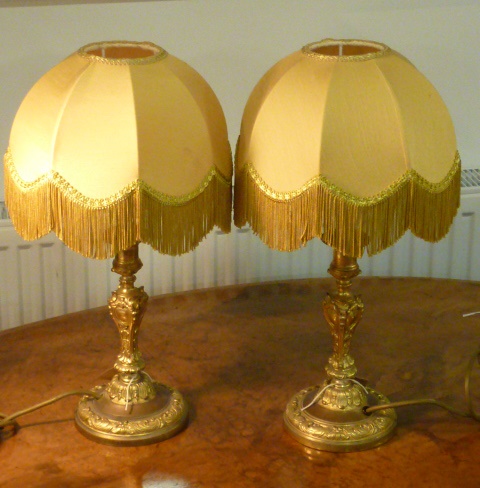 A pair of 19th century gilt metal Candlesticks as lamps with Shades,