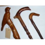 Three early 20th century gentleman's Walking Sticks, one carved with a bird,