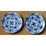 A pair of 18th century Delftware Dishes typically decorated with blue sprigs etc.