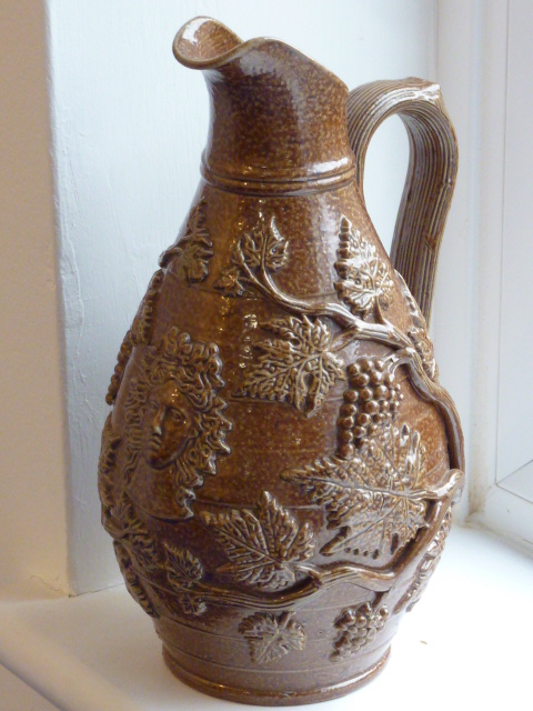 A 19th century Stoneware Jug of baluster form,