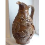 A 19th century Stoneware Jug of baluster form,