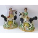 A pair of hand decorated 19th century Staffordshire Figures of young children upon the backs of