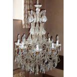 A large and impressive cut glass Chandelier with many individual facet-cut droplets,