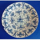 An 18th century Dutch Delft tin-glazed Charger decorated in the Chinese taste,