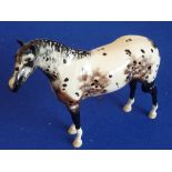 A 20th century Beswick, England "Appaloosa Stallion" standing four-square,