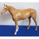 A large 20th century Beswick Figure of a standing Palomino Horse,