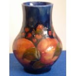 A Moorcroft Pomegranate baluster-shaped Vase, blue background, dated around 1924-1929, 12.