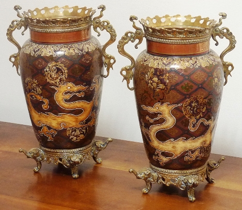 An unusual pair of 19th century enamelled and brass mounted two-handled Vases,