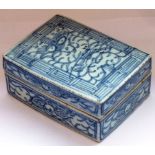 An 18th century Chinese porcelain, rectangular Box and cover naively decorated with scrolls etc.