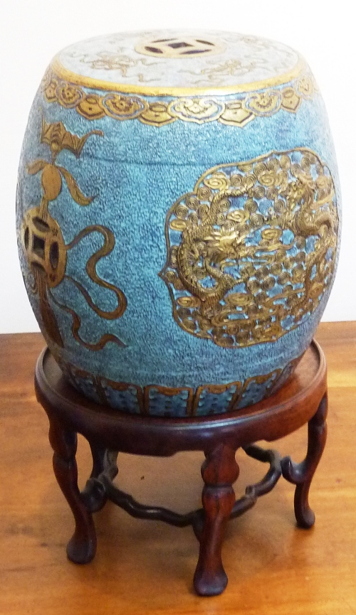 A small Chinese stoneware barrel-shaped Garden Seat with pierced Shou characters and auspicious