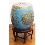 A small Chinese stoneware barrel-shaped Garden Seat with pierced Shou characters and auspicious