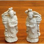 An opposing pair of late-19th / early-20th Century Chinese Blanc de Chine Figures of Guanyin as