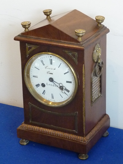 An early-19th century period mahogany and brass inlaid eight-day Mantel Clock,