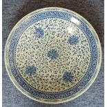 A large 19th century Chinese porcelain circular Charger hand-decorated in underglaze blue with a