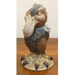 A small Burslem Pottery stoneware Jar and Cover in the style of a Martin Brothers grotesque bird,