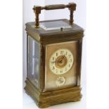 A large 19th Century gilt brass cased (rubbed) repeater Carriage Clock with alarm mechanism,