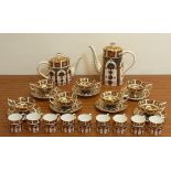 A Royal Crown Derby Tea/Coffee Service hand gilded and decorated in the 1128 Imari pattern,