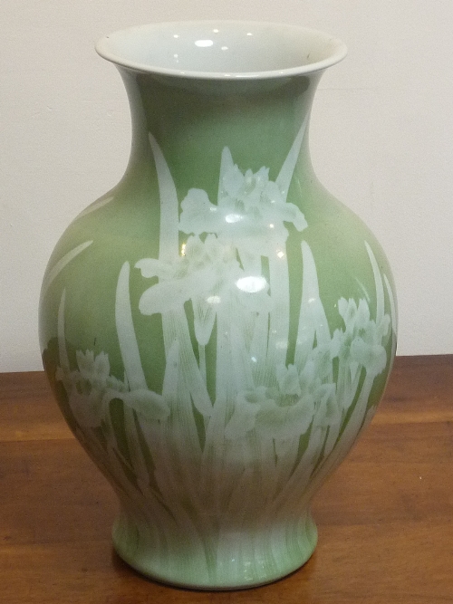 A large Japanese baluster-shaped porcelain Vase decorated with Irises against an olive green ground,