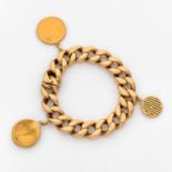 BRACELET GOURMETTEen or rose 18K retenant en pampille trois médailles en or jaune 18K.Poids brut :