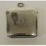 An Edwardian silver vesta case engraved with scrolling initials, Brimingham 1909