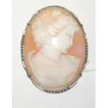 A large 20th Century cameo brooch carved with the head of a young lady. The metal mount set with