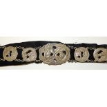 An early 20th Century Japanese white metal belt, the links and clasp well cast with tiger and