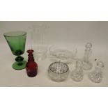 A Dartington glass pedestal fruit bowl; a tall clear glass vase; a large green glass goblet; a red