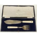 A George V silver and ivory cased fish servers each with engraved monogram to handles, Sheffield