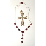 A gold mounted (tested) garnet negligee necklace, set with ten faceted garnets (one possibly