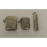 A small silver vesta case with guilloche decoration, Chester 1904; another silver vesta case and a