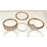A 9ct gold wedding band, ring size H, 1.3g approx. A 9ct gold dress ring, set with five quartz clear