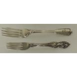 A decorative Victorian silver dessert fork together with another silver fork approx 3.1oz