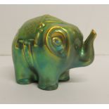 A small Zsolnay, Pecs figure of an elephant in iridescent green glaze, factory marks to base, 7.5cms