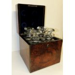 A Victorian brass bound burr walnut decanter box fitted for four decanters and containing four clear