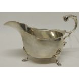 An Edwardian silver cream boat with flying scroll handle, approx 4.6oz