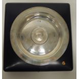 A cased modern silver dish centred with central commemorative medallion dated 1974, 13cms diam total