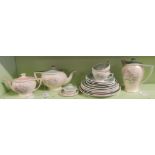 A Susie Cooper part tea service decorated in pastel shades with floral decoration