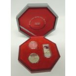 A cased 2004 Lunar Series Coin Set containing Singapore $10 2oz silver coin and another