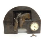 An early 20th Century bronze cased mantel timepiece, the small timepiece mounted to one side of