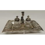 A small Victorian silver desk stand of rectangular form with pierced and engraved foliate edge,