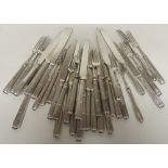 A silver part set of tea knives and forks, comprising 17 forks and 18 knives all with silver blades,