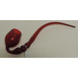 A 19th Century Nailsea ruby glass pipe with long curved stem and wide bowl, approx 46cms long