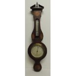 An early 20th Century aneroid barometer and thermometer mounted in inlaid wheel shaped case with