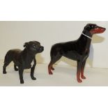 A Beswick figure of a standing Doberman, 15cms high together with a Beswick figure of a standing