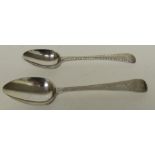 A Georgian silver dessert spoon with bright cut decoration together with a Georgian silver bright