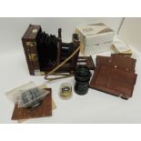 A Swift & Son The "Challenge" mahogany and brass case folding camera with The Swift shutter