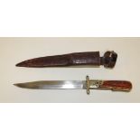 An early 20th Century hunting knife with long single edged folding blade marked "RSC Works" and "